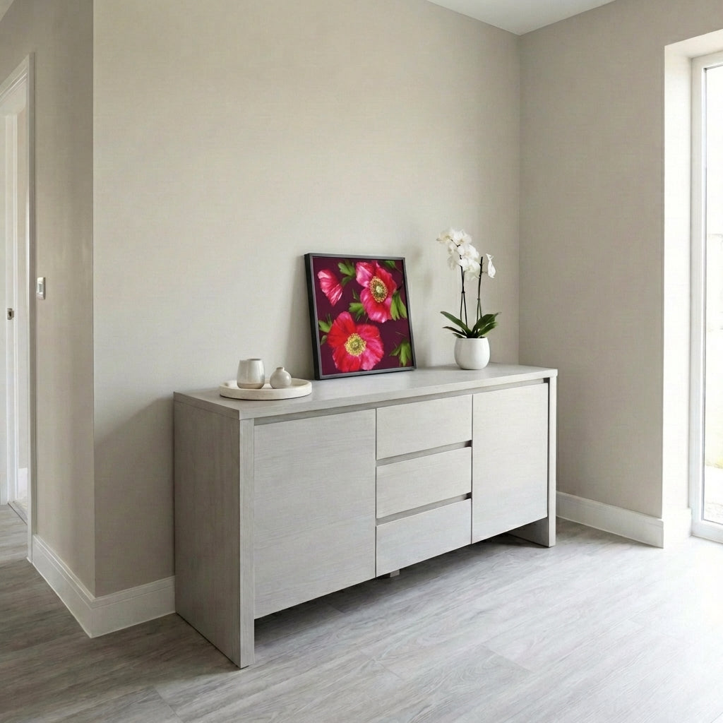 Light grey sideboard with Isla burgundy resting on a beige walls and wooden flooring.