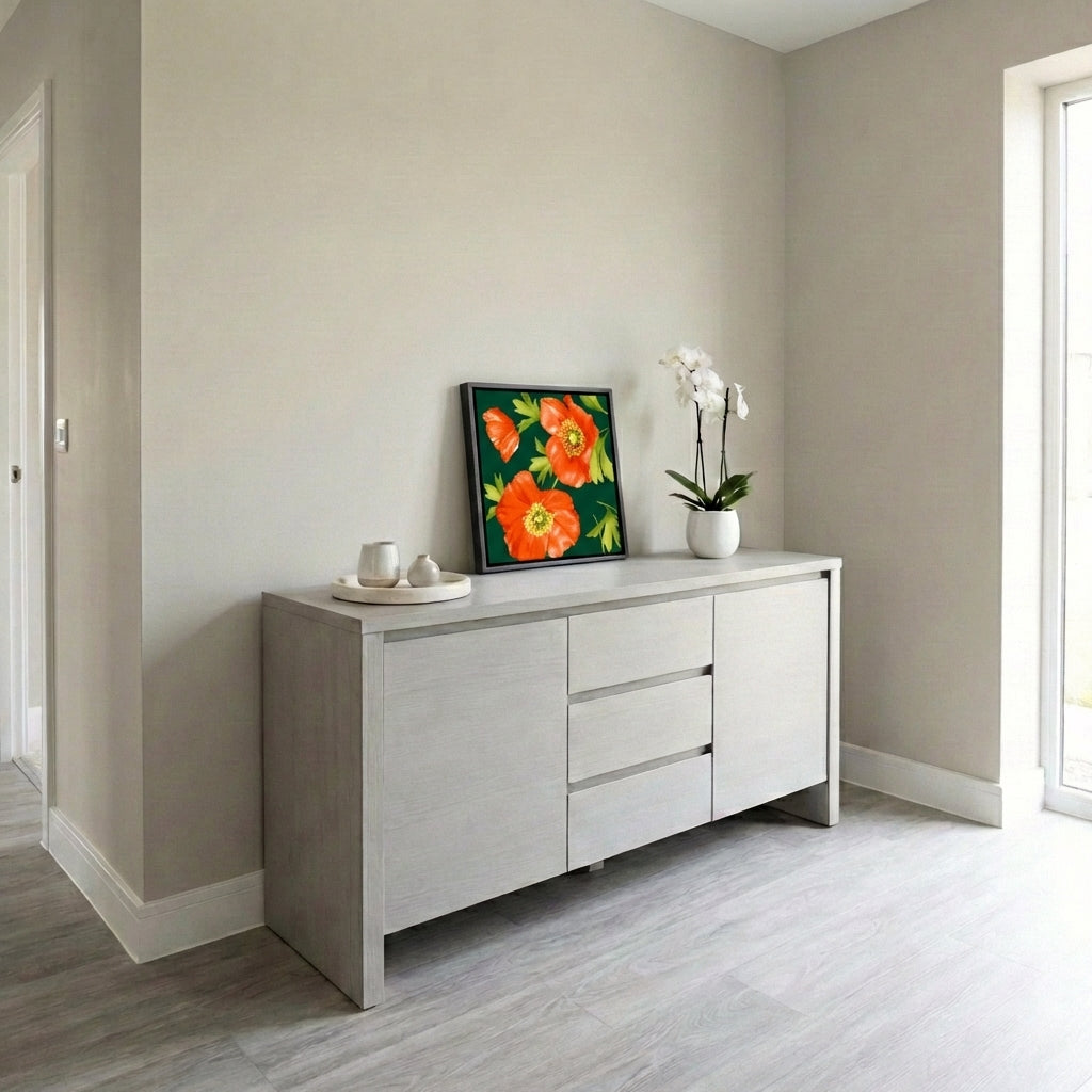 Light grey sideboard with Isla Emerald resting on a beige walls and wooden flooring.
