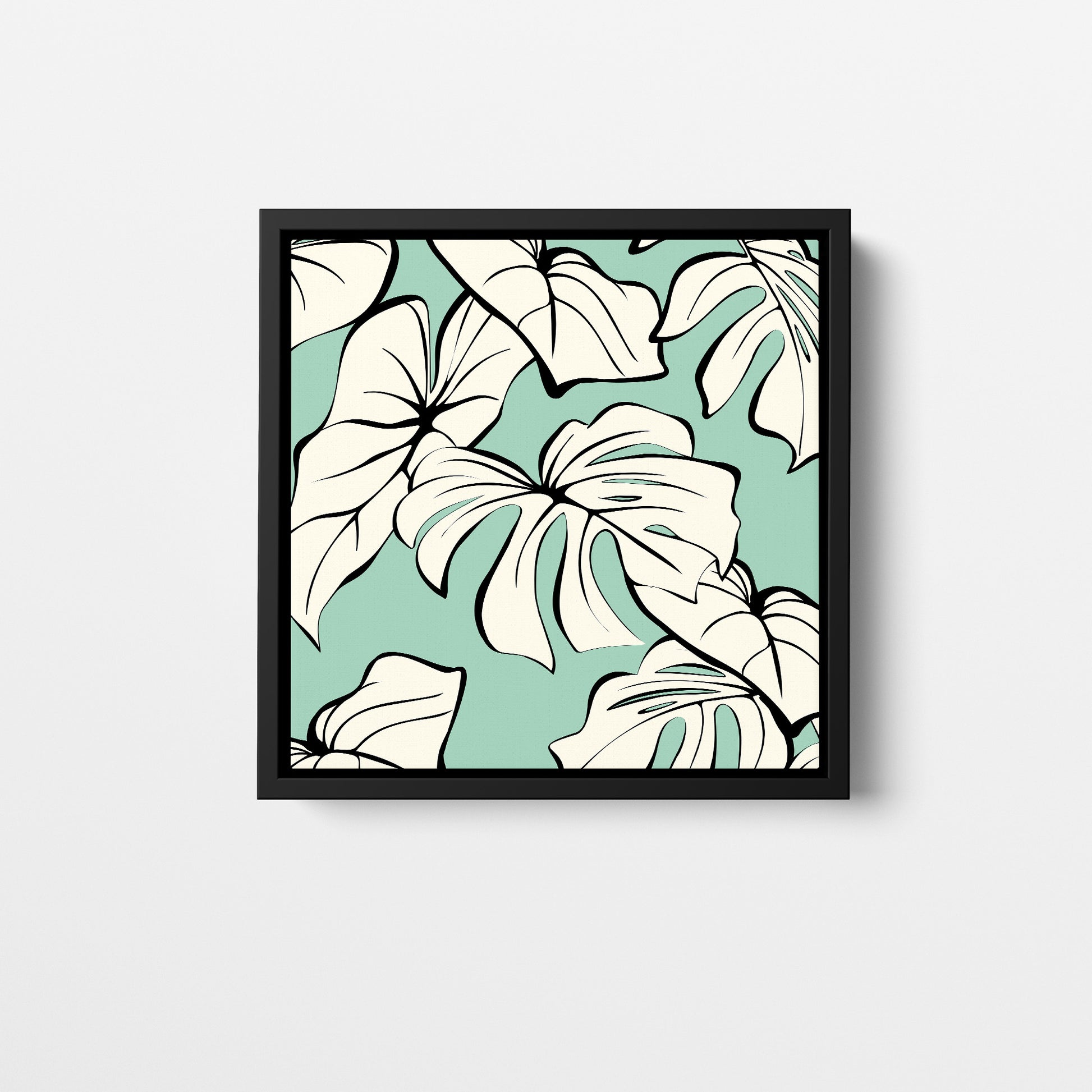 Kai Mint mini tropical wall art - sophisticated cream leaves with bold black outlines on soft mint green background, framed print front view