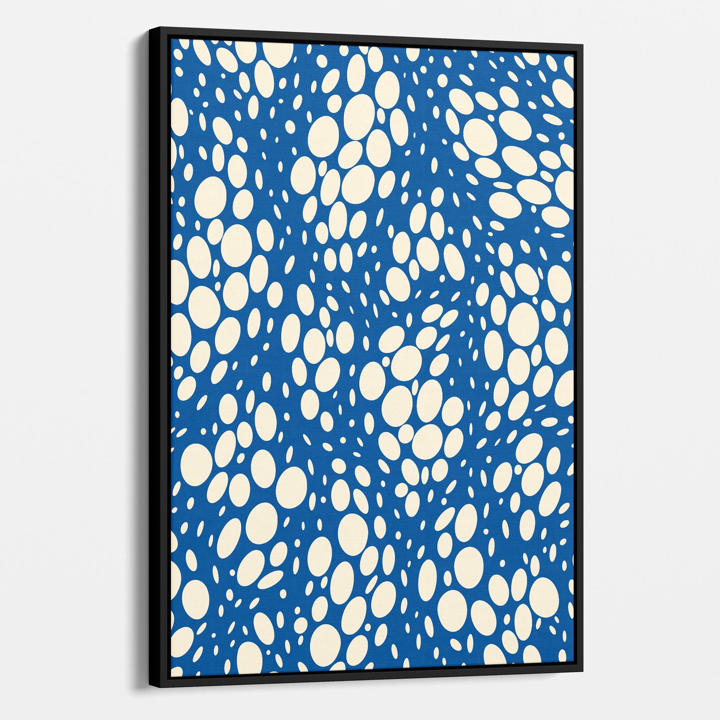 Spots Blue abstract wall art angled view showing frame depth - dynamic organic polka dot design with scattered white spots