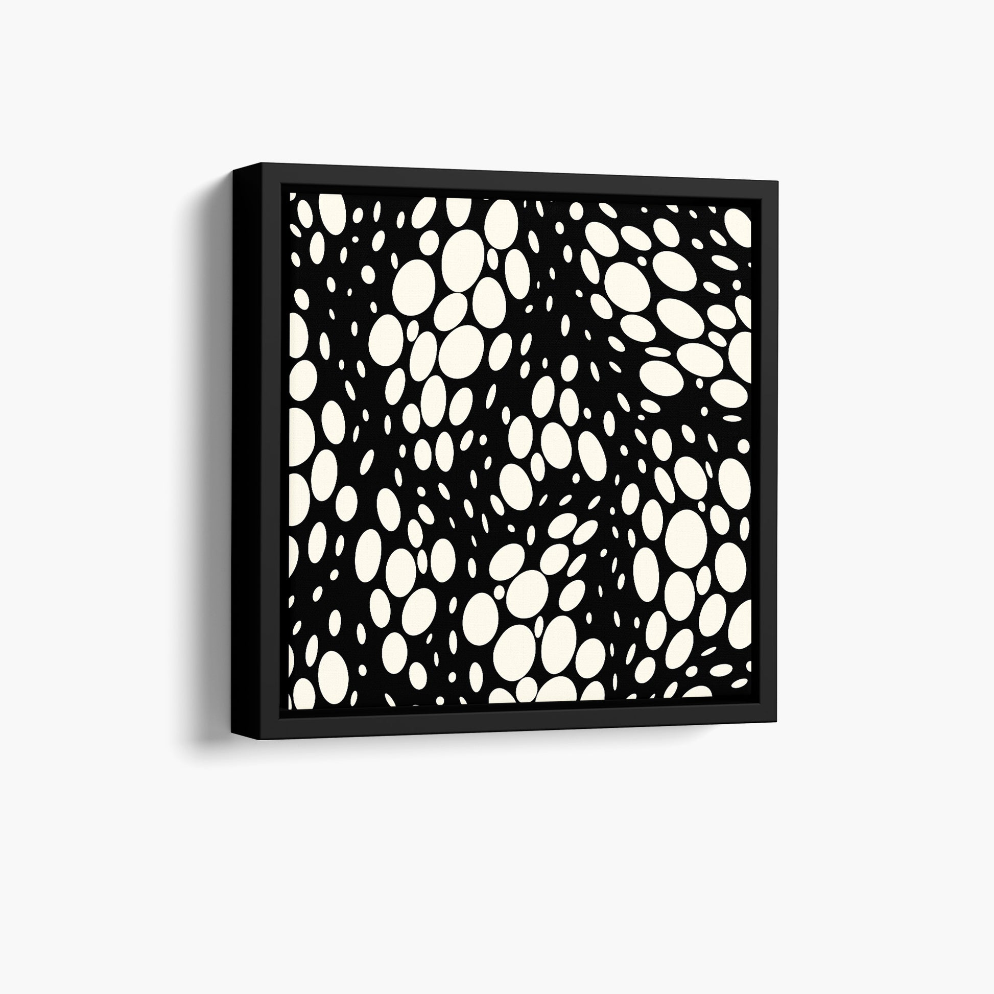 Spots black mini abstract wall art angled view showing frame depth - dynamic organic polka dot design with scattered cream spots