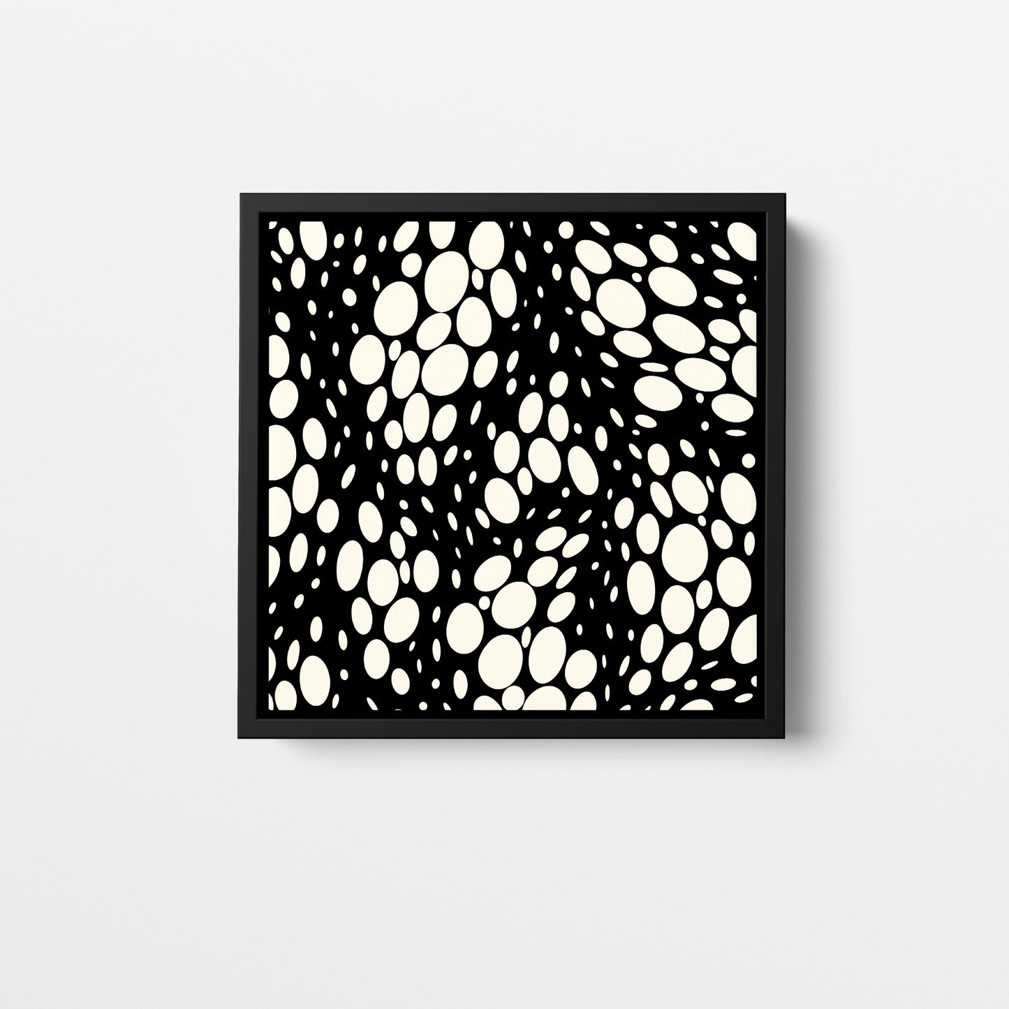 Spots black mini square abstract wall art - monochromatic pattern with irregular cream ovals on black background, framed print front view