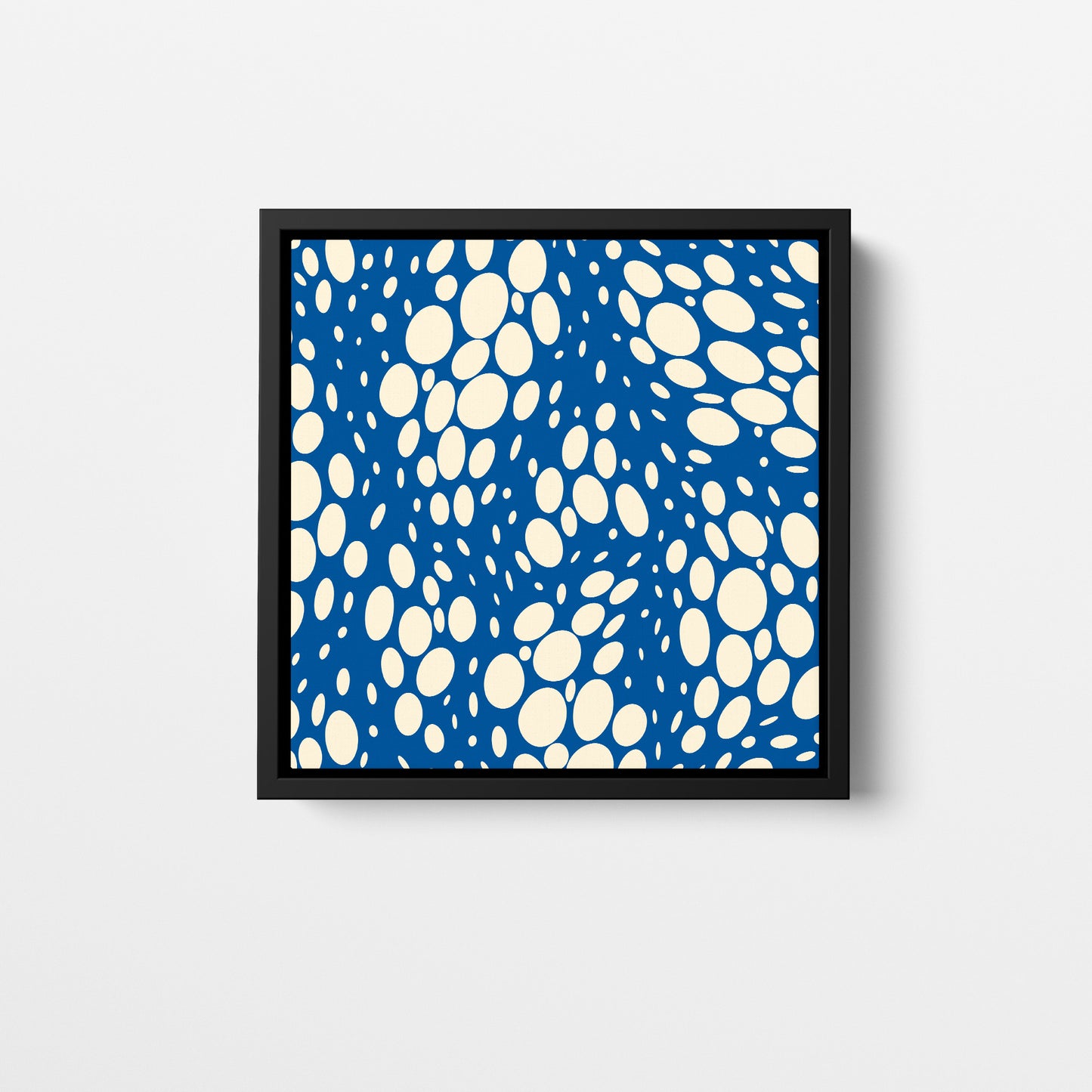 Spots Blue mini abstract wall art - vibrant pattern with irregular white ovals on bold blue background, framed print front view