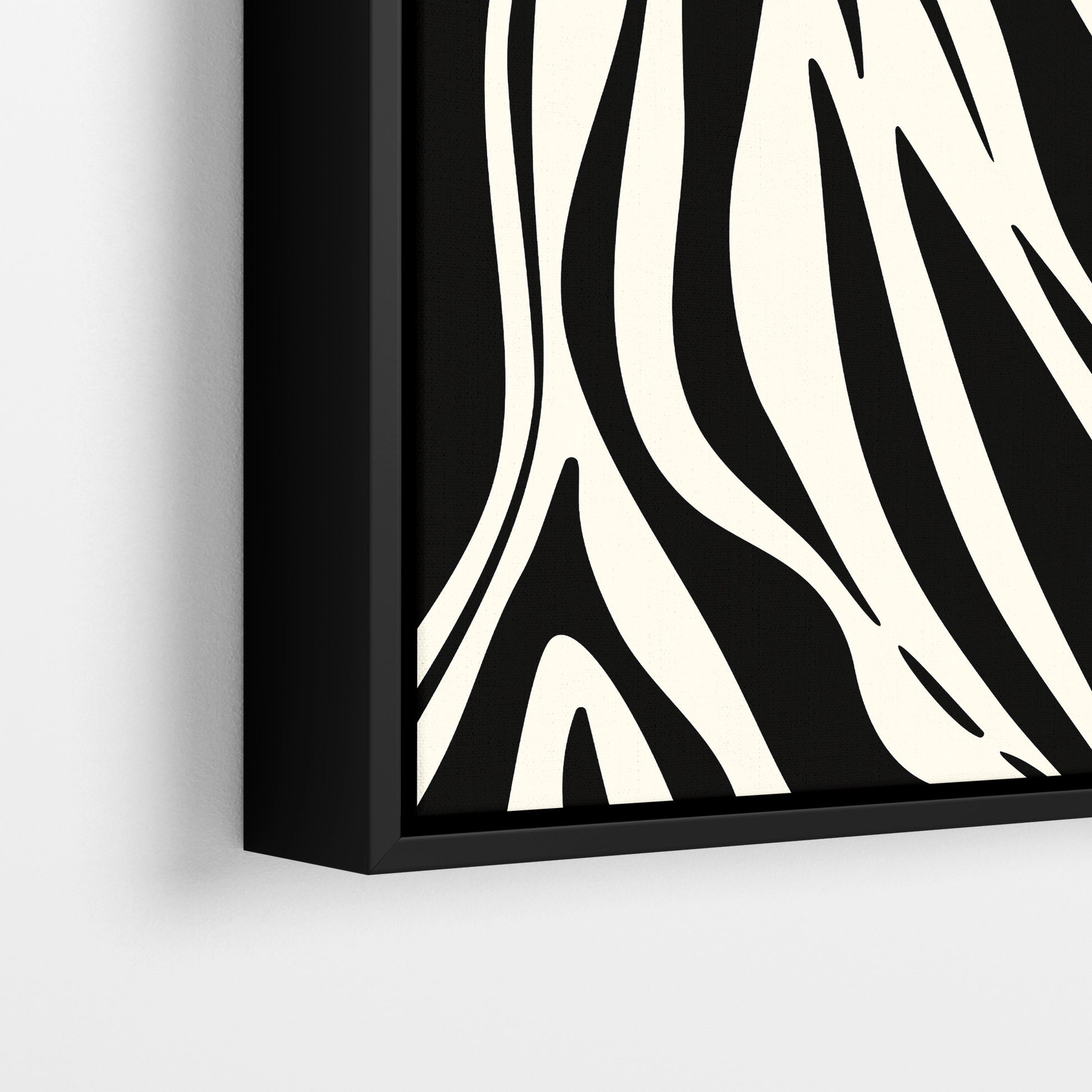 Close-up detail of Paloma Black framed abstract print - fluid interlocking forms creating zebra-like pattern in black and cream