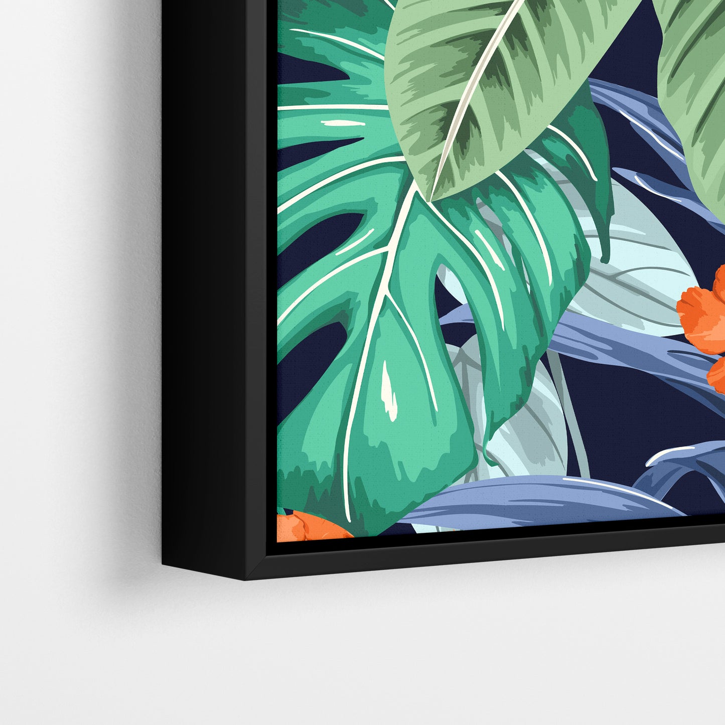Close-up detail of Solana Orange framed tropical print - jungle foliage in green, blue and grey tones with striking orange flowers