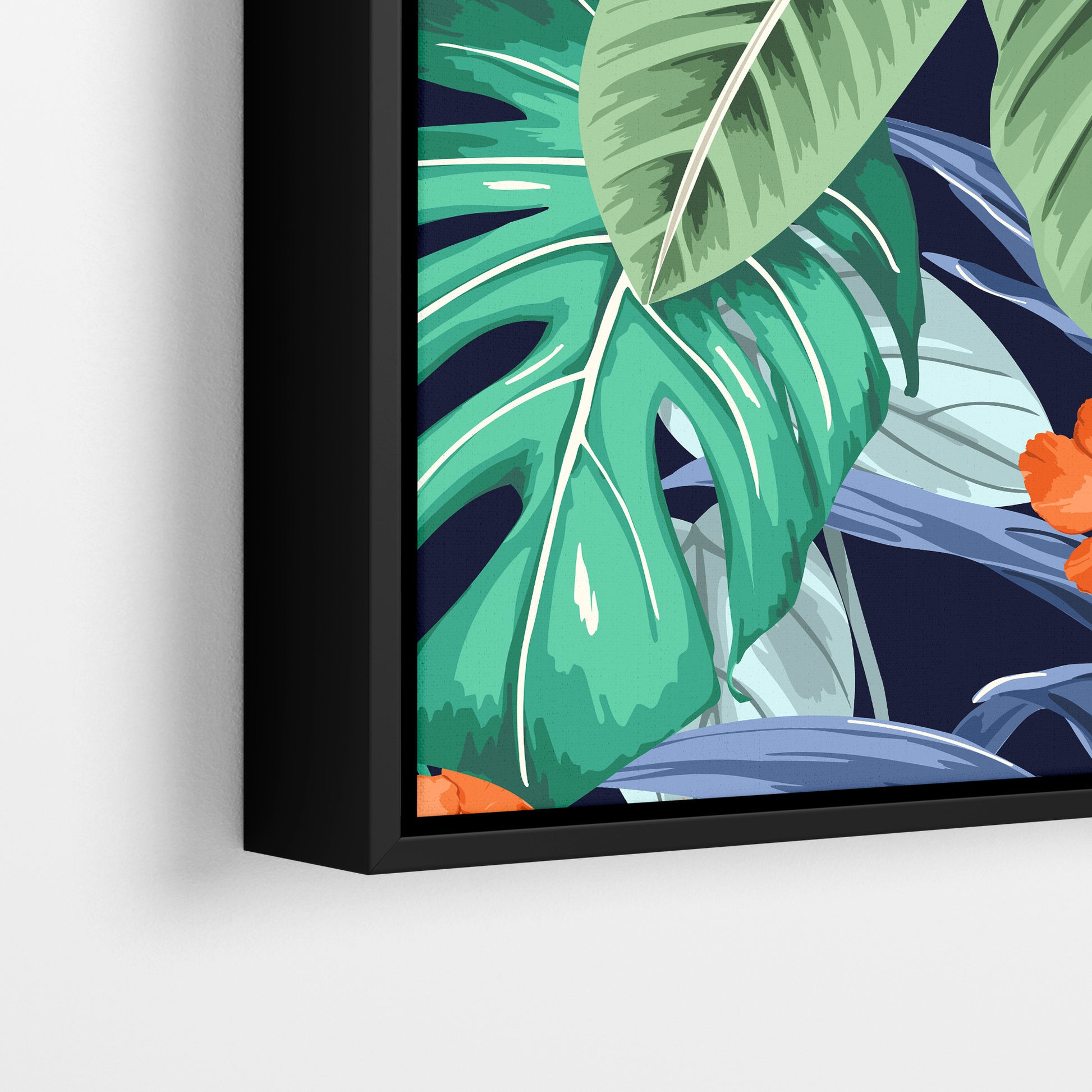 Close-up detail of Solana Orange framed tropical print - jungle foliage in green, blue and grey tones with striking orange flowers