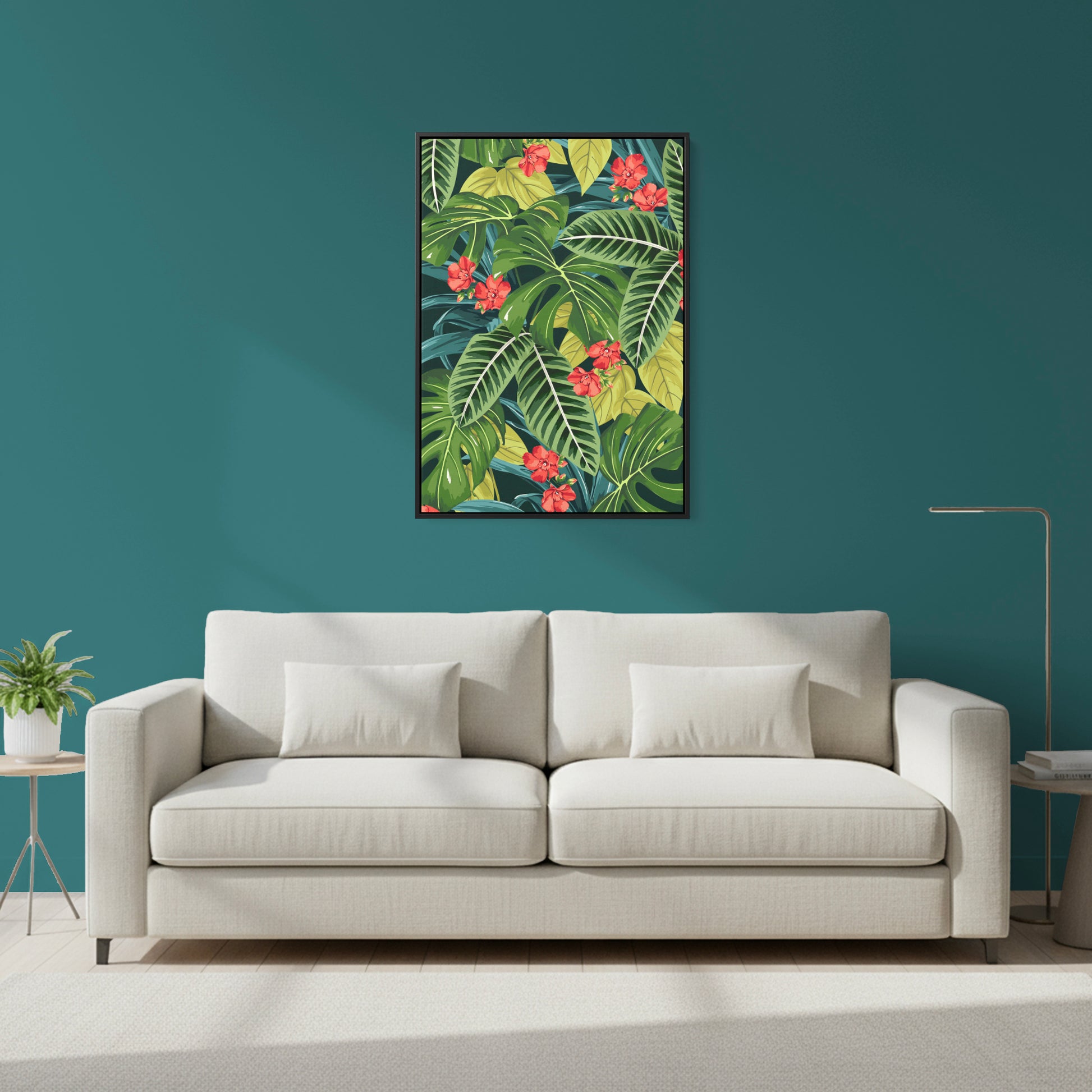 Beige sofa in a room with a Solana Scarlet tropical leaf painting on the wall.