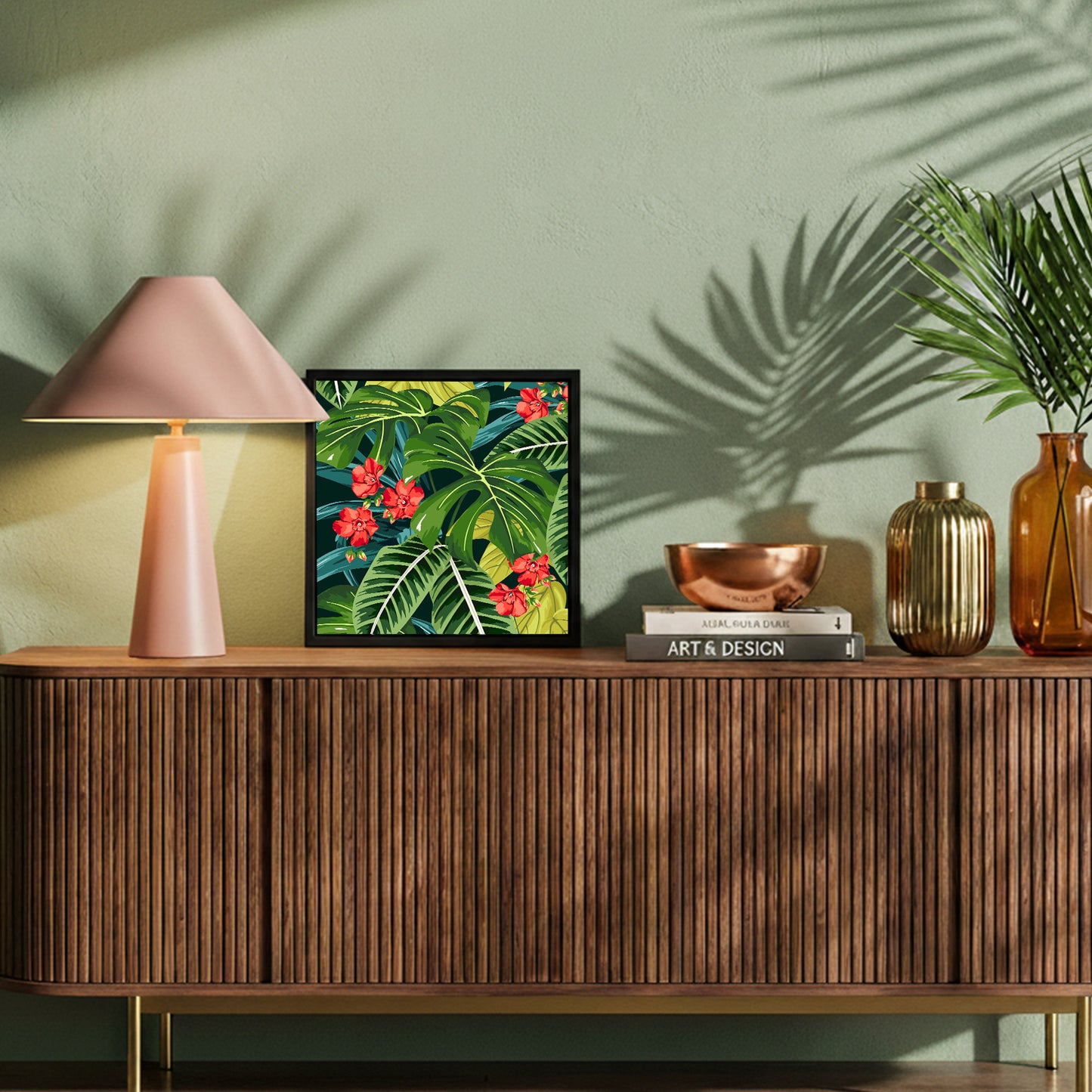 Decorative setup on a wooden console table with a lamp, framed Solana Scarlet Mini art, and decorative items.