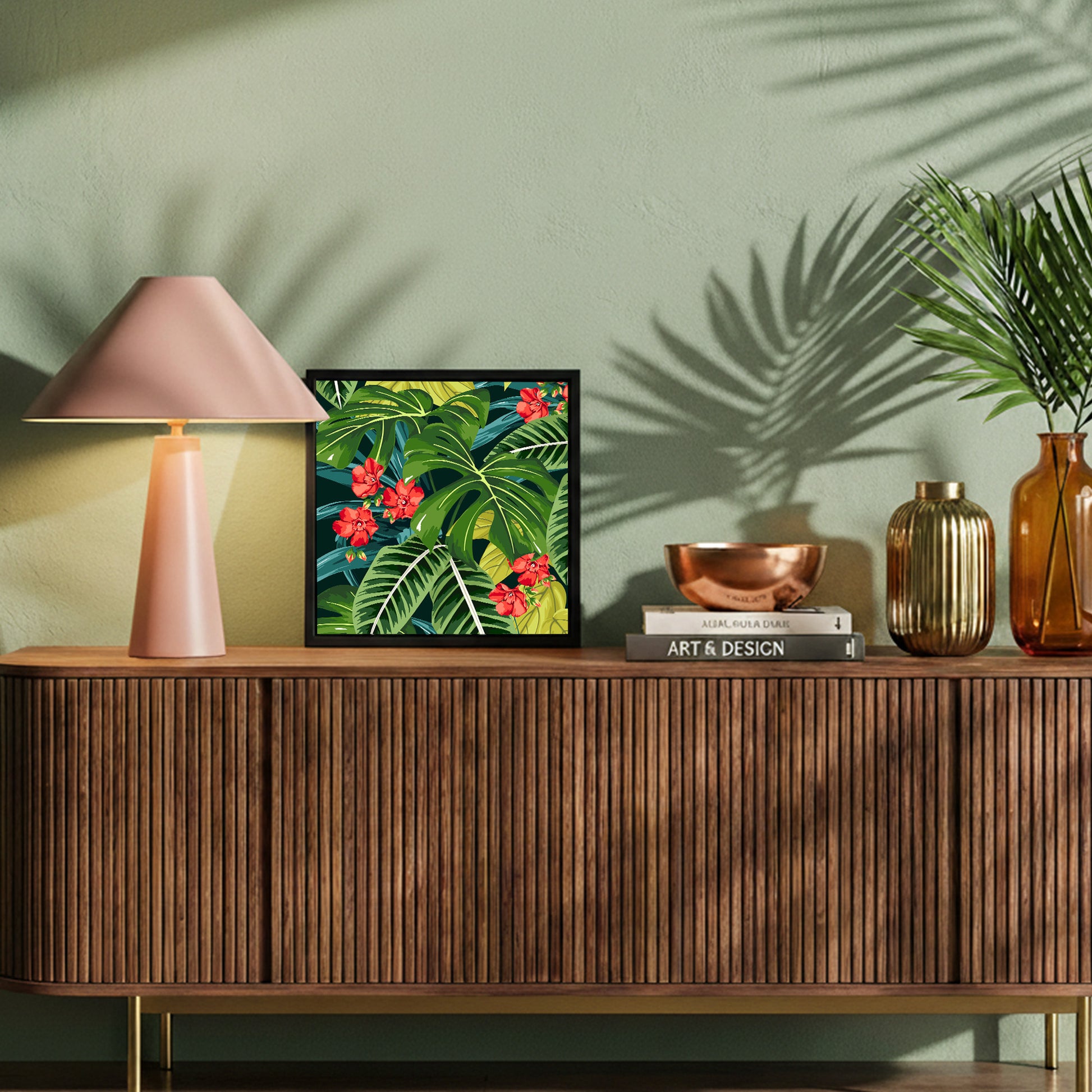 Decorative setup on a wooden console table with a lamp, framed Solana Scarlet Mini art, and decorative items.