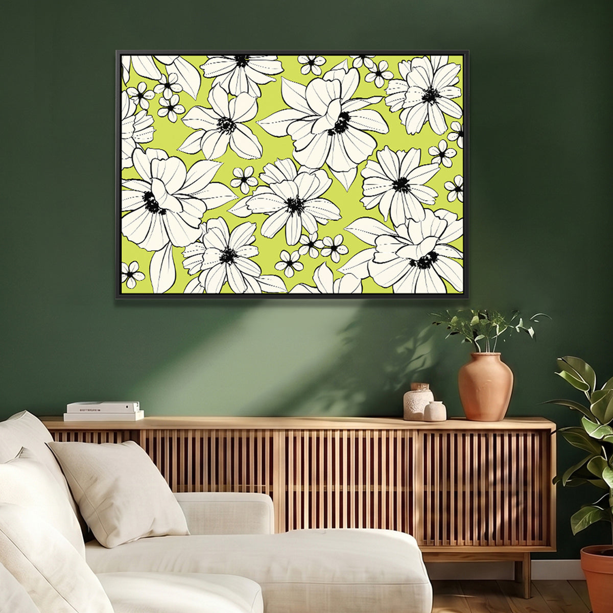 Florian Chartreuse framed wall art print featuring a bold line art floral pattern on a bright chartreuse background, displayed in a modern living room setting above a wooden credenza against a dark green wall.