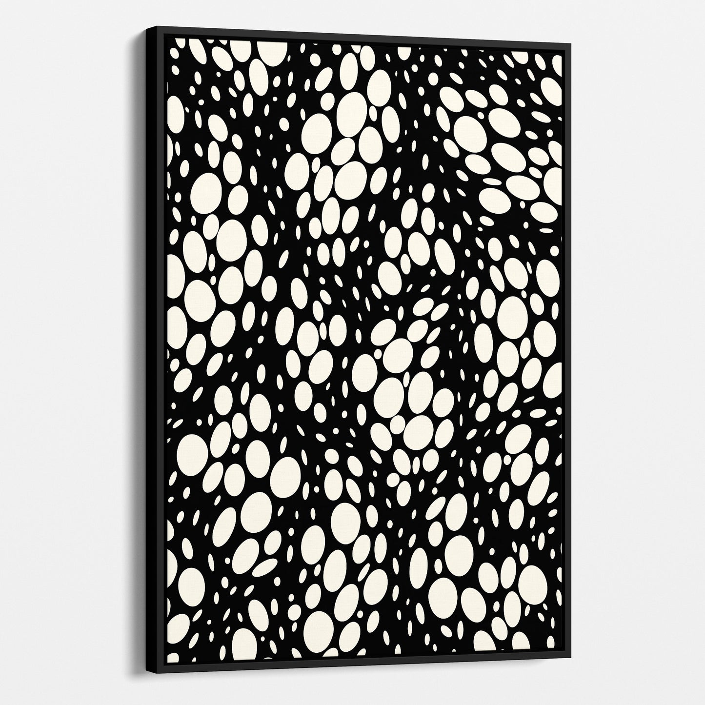 Spots black abstract wall art angled view showing frame depth - dynamic organic polka dot design with scattered cream spots