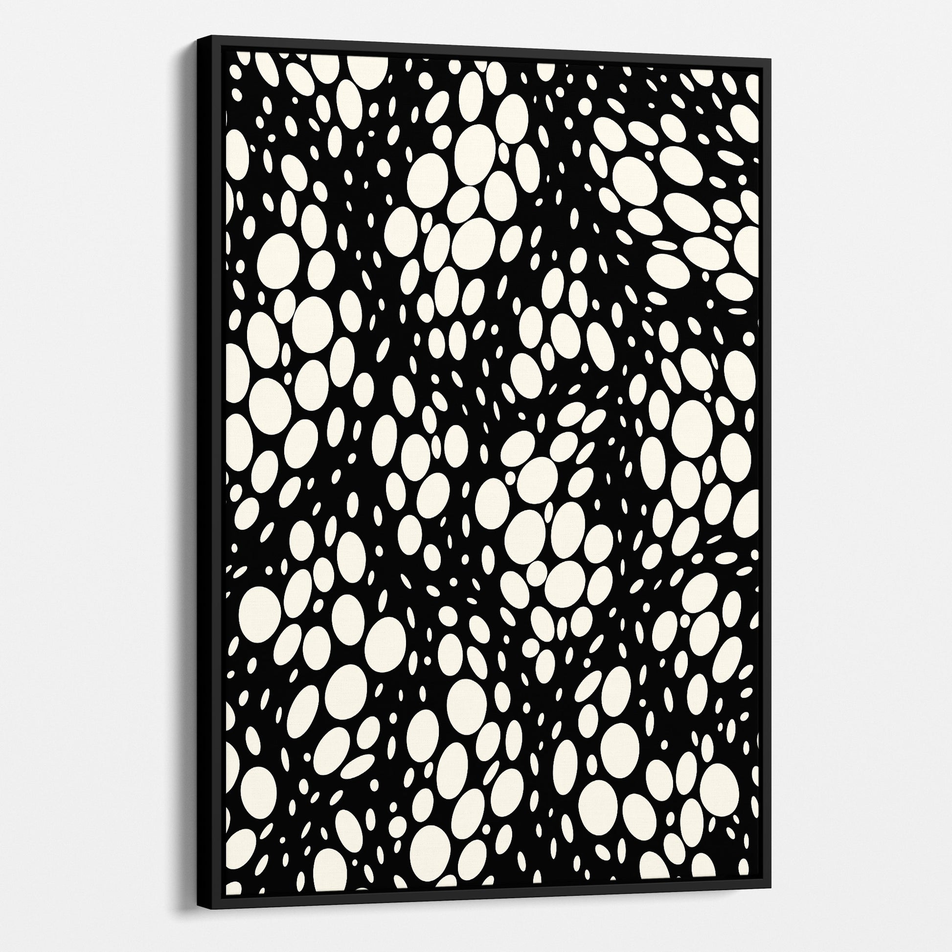 Spots black abstract wall art angled view showing frame depth - dynamic organic polka dot design with scattered cream spots