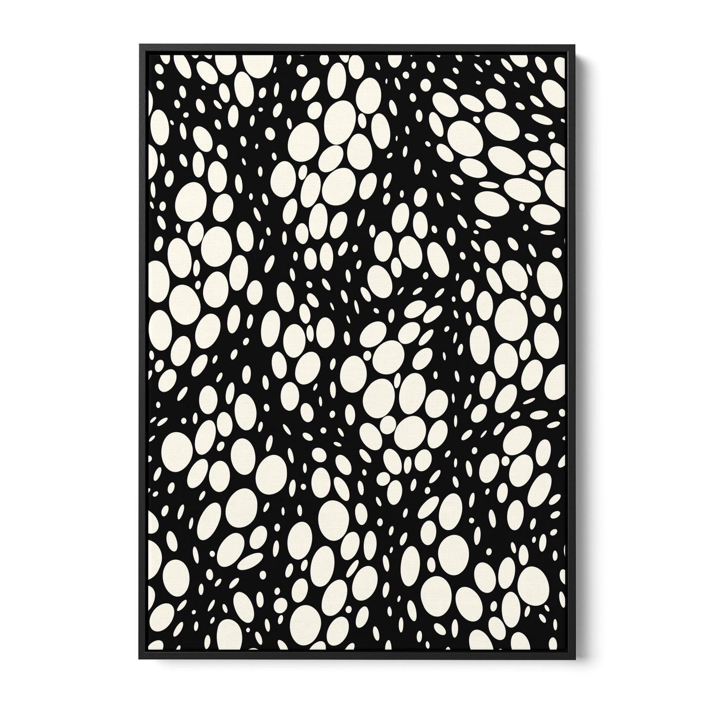 Spots black abstract wall art - monochromatic pattern with irregular cream ovals on black background, framed print front view