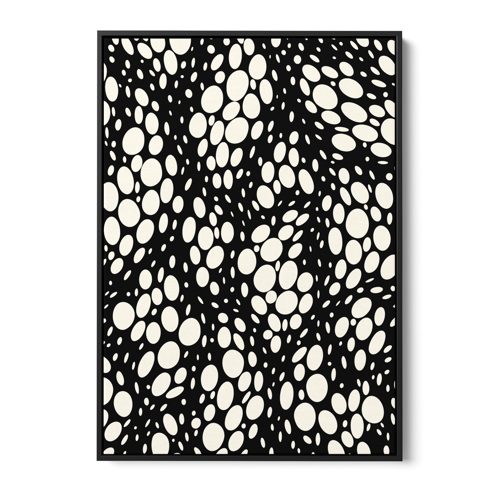 Spots black abstract wall art - monochromatic pattern with irregular cream ovals on black background, framed print front view