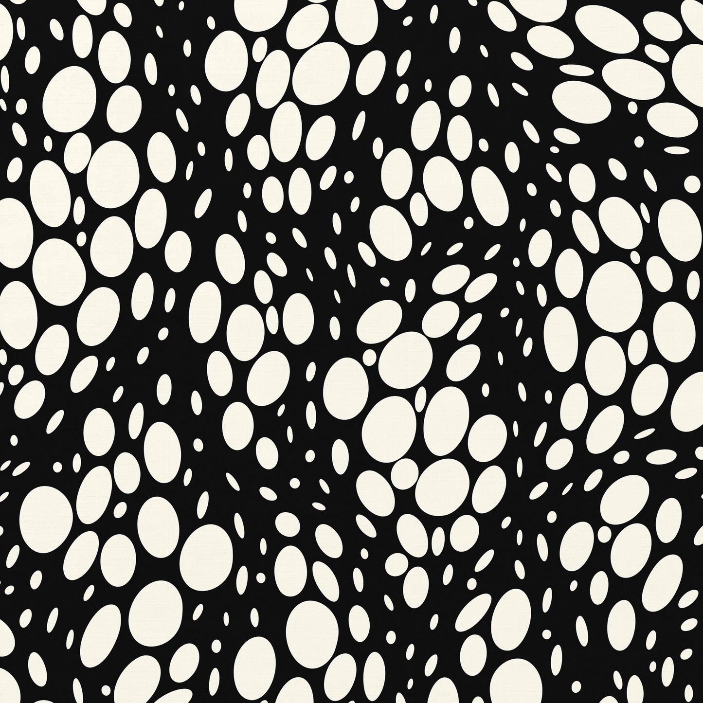 Detail view of Spots black abstract print - hundreds of varied-size white oval shapes creating texture on black background