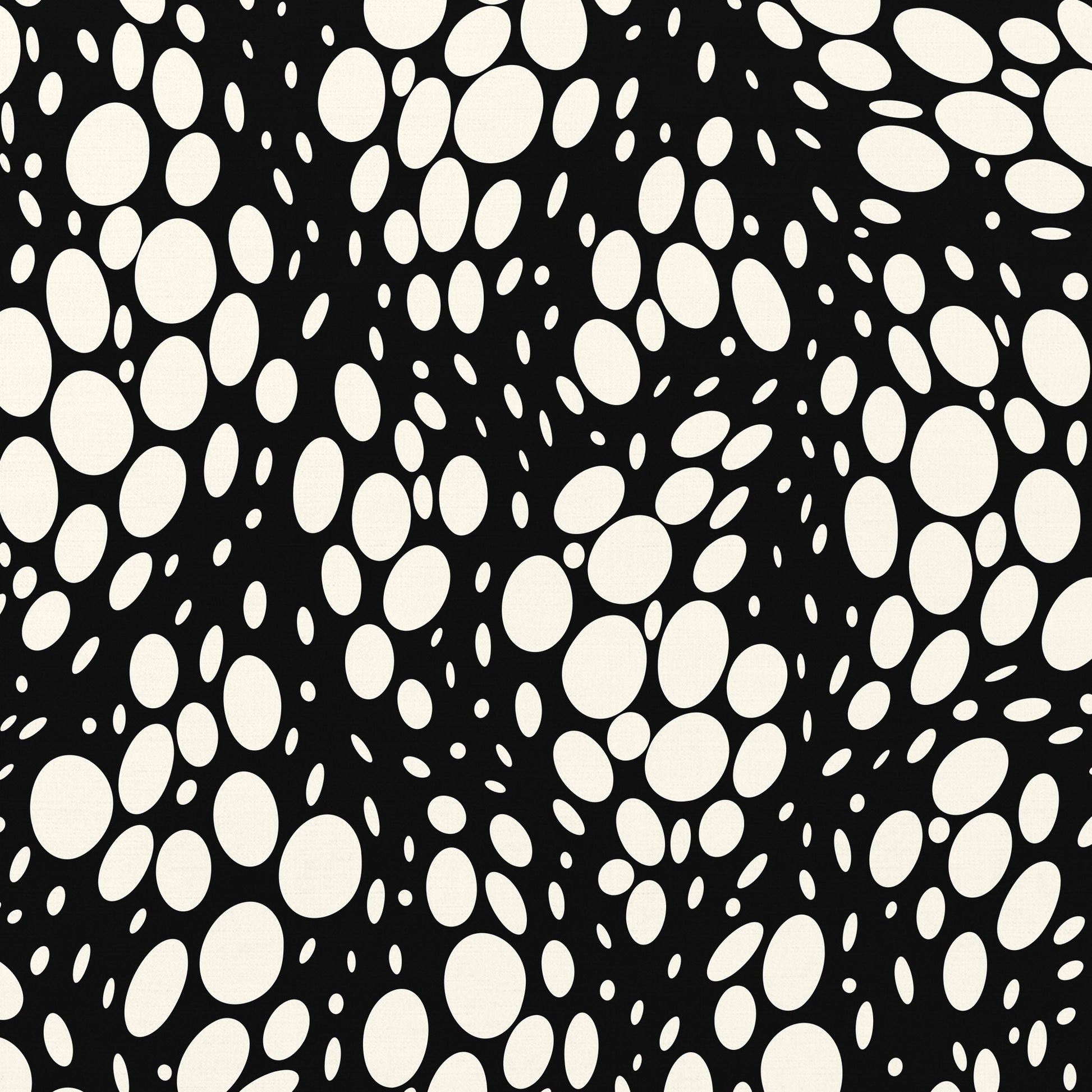 Detail view of Spots black abstract print - hundreds of varied-size white oval shapes creating texture on black background