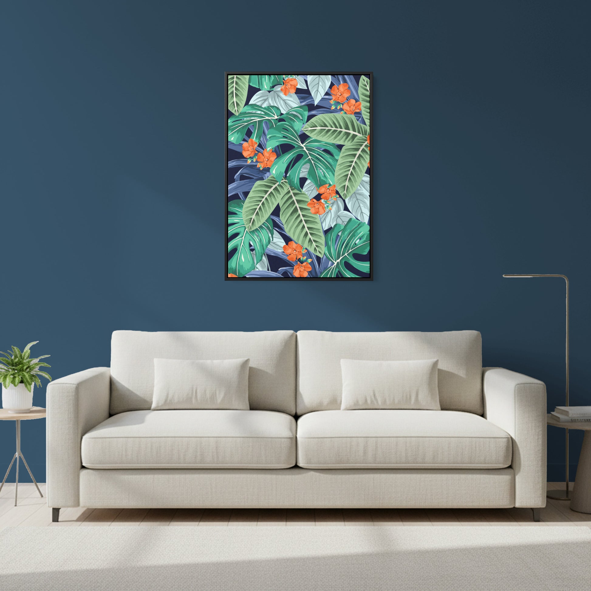 Beige sofa in a living room with a Solana Orange tropical leaf painting on the wall.