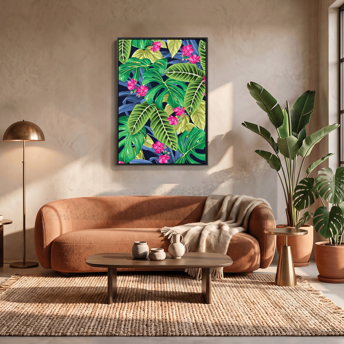 Solana Pink wall art print featuring a tropical leafy design with bright green leaves and pink flowers, hanging above a rust-brown velvet sofa in a styled living room.